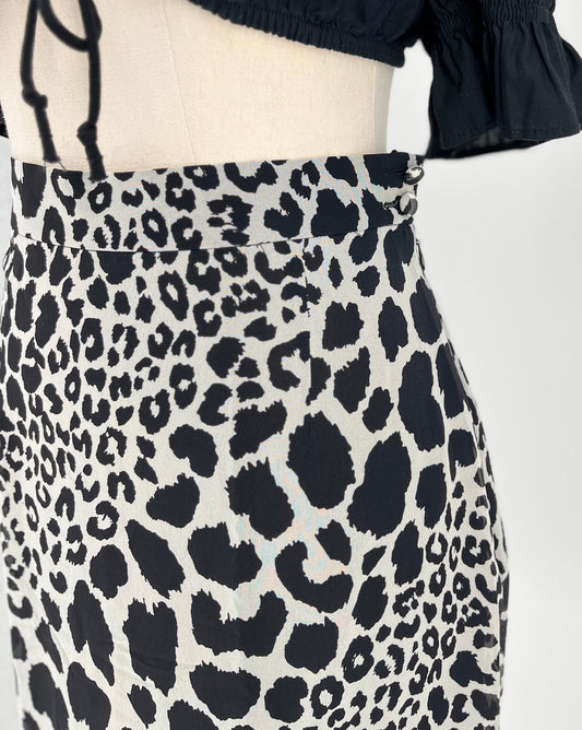 Leopard print skirt on a mannequin with a white background
