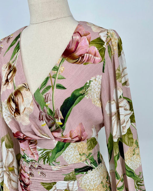 Floral patterned fabric on a mannequin with a plain background