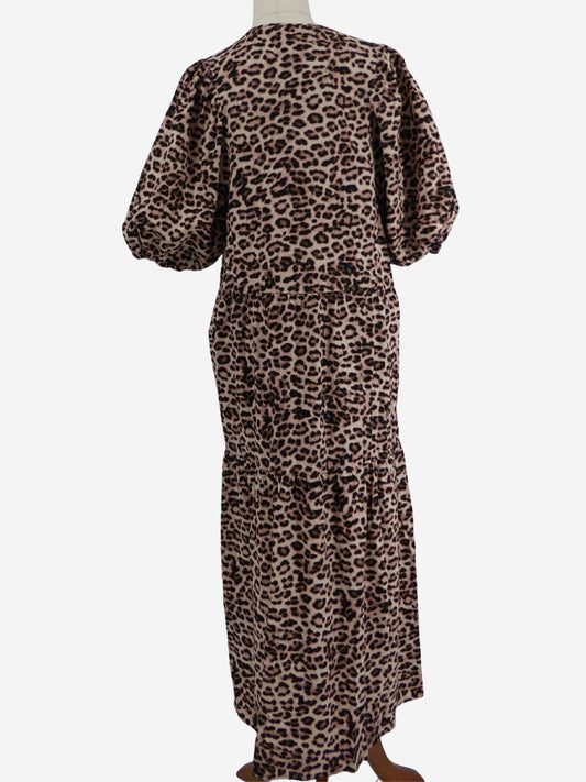Back view of a long-sleeve Decjuba midi dress with an animal print design, displayed on a mannequin against a white studio background.
