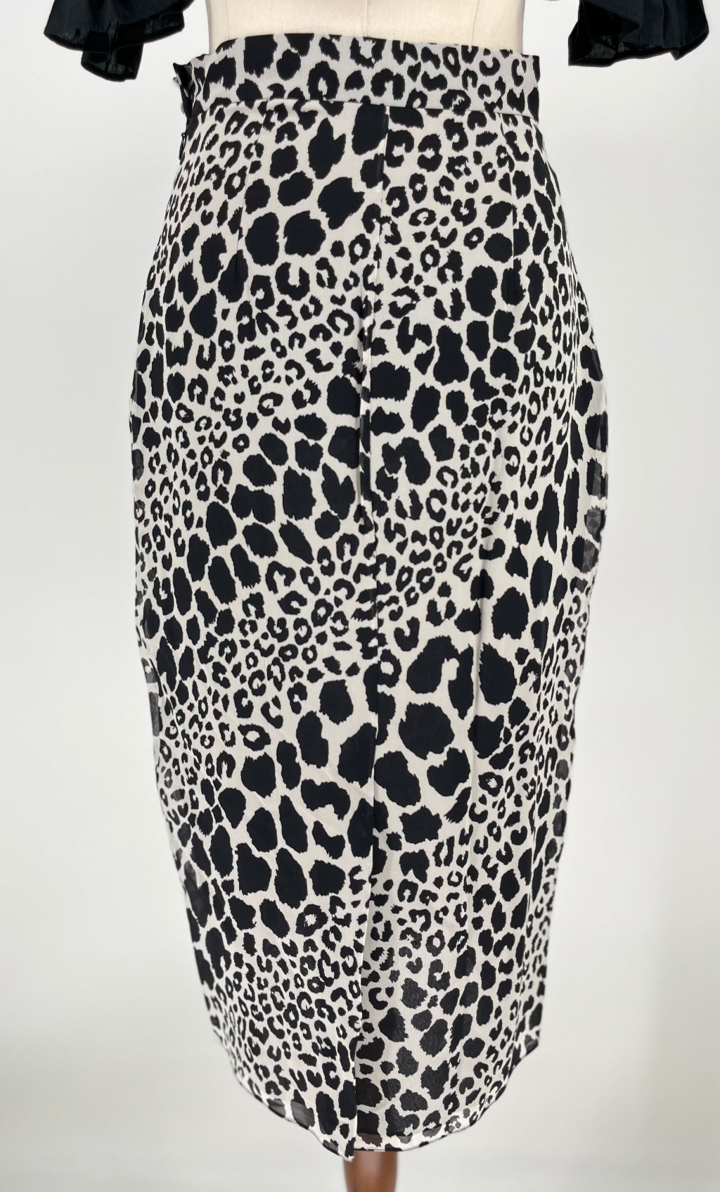 Leopard print skirt on a mannequin against a white background