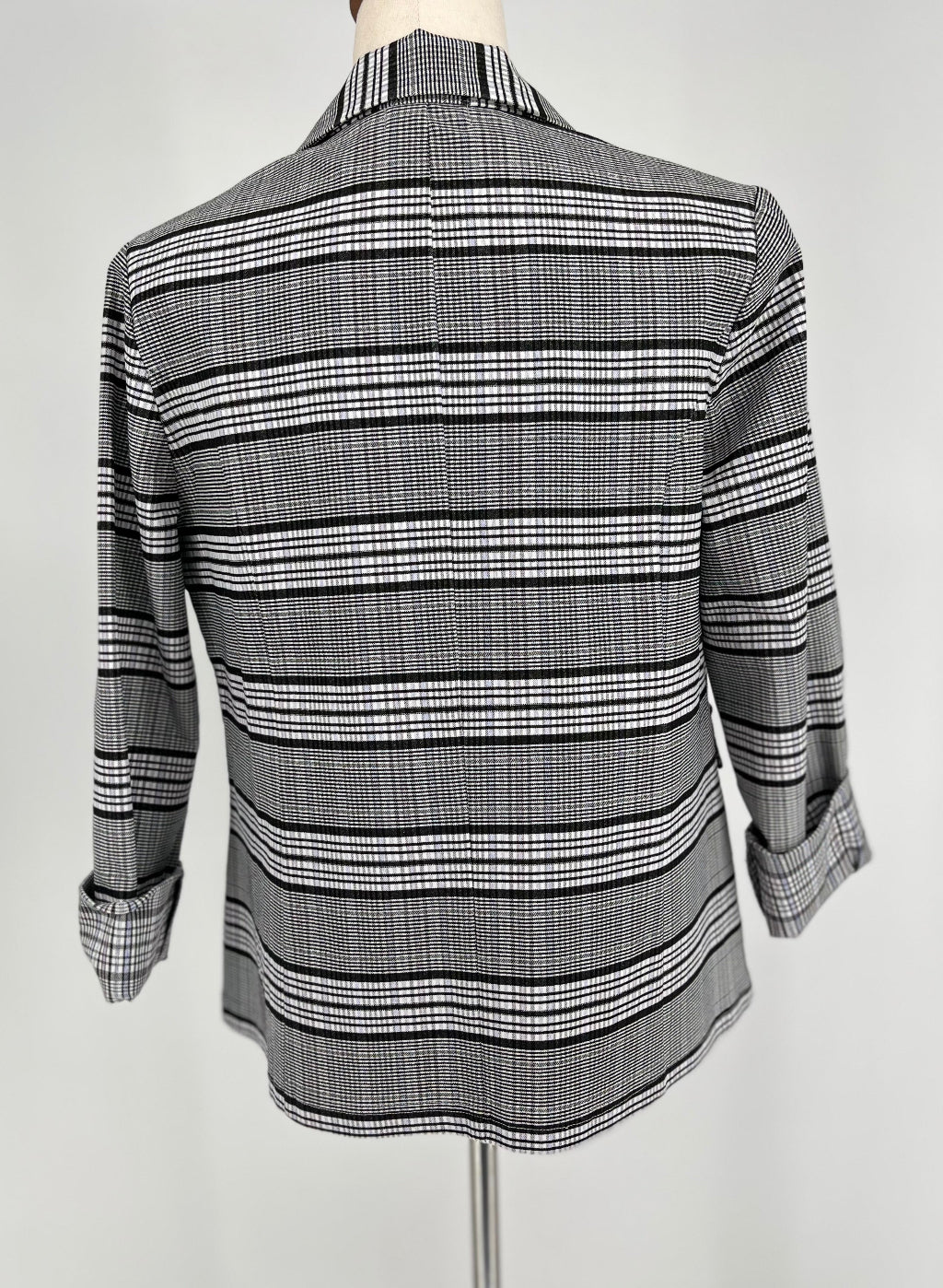 black and white checked jacket on mannequin