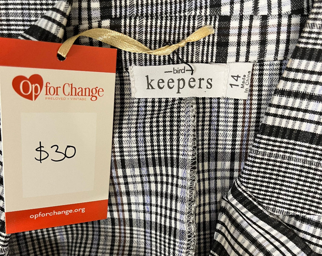 black and white checked jacket label on mannequin