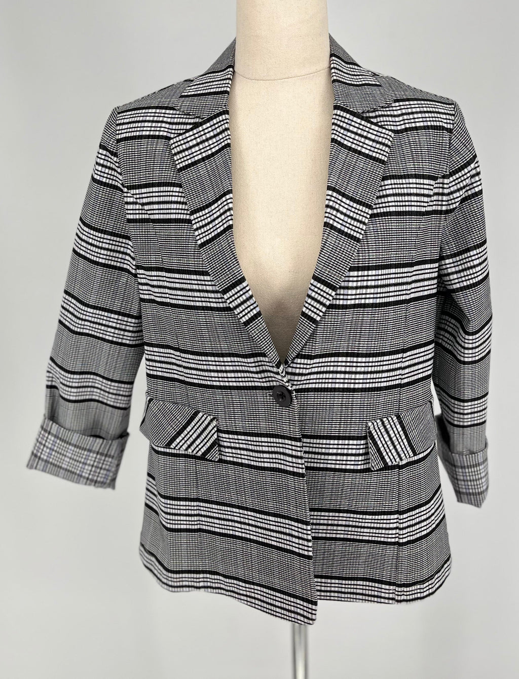 black and white checked jacket on mannequin