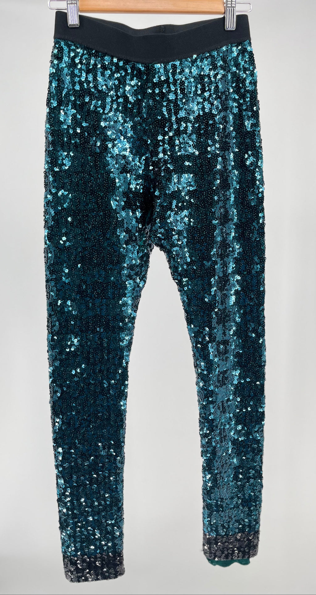 Blue sequin pants on a white background