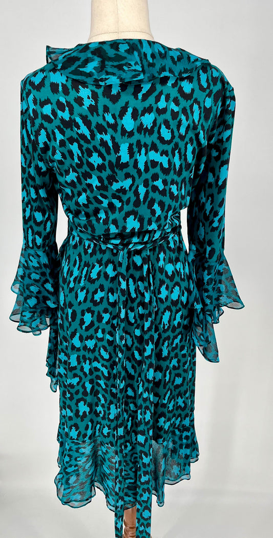 Teal leopard print dress on a mannequin against a white background