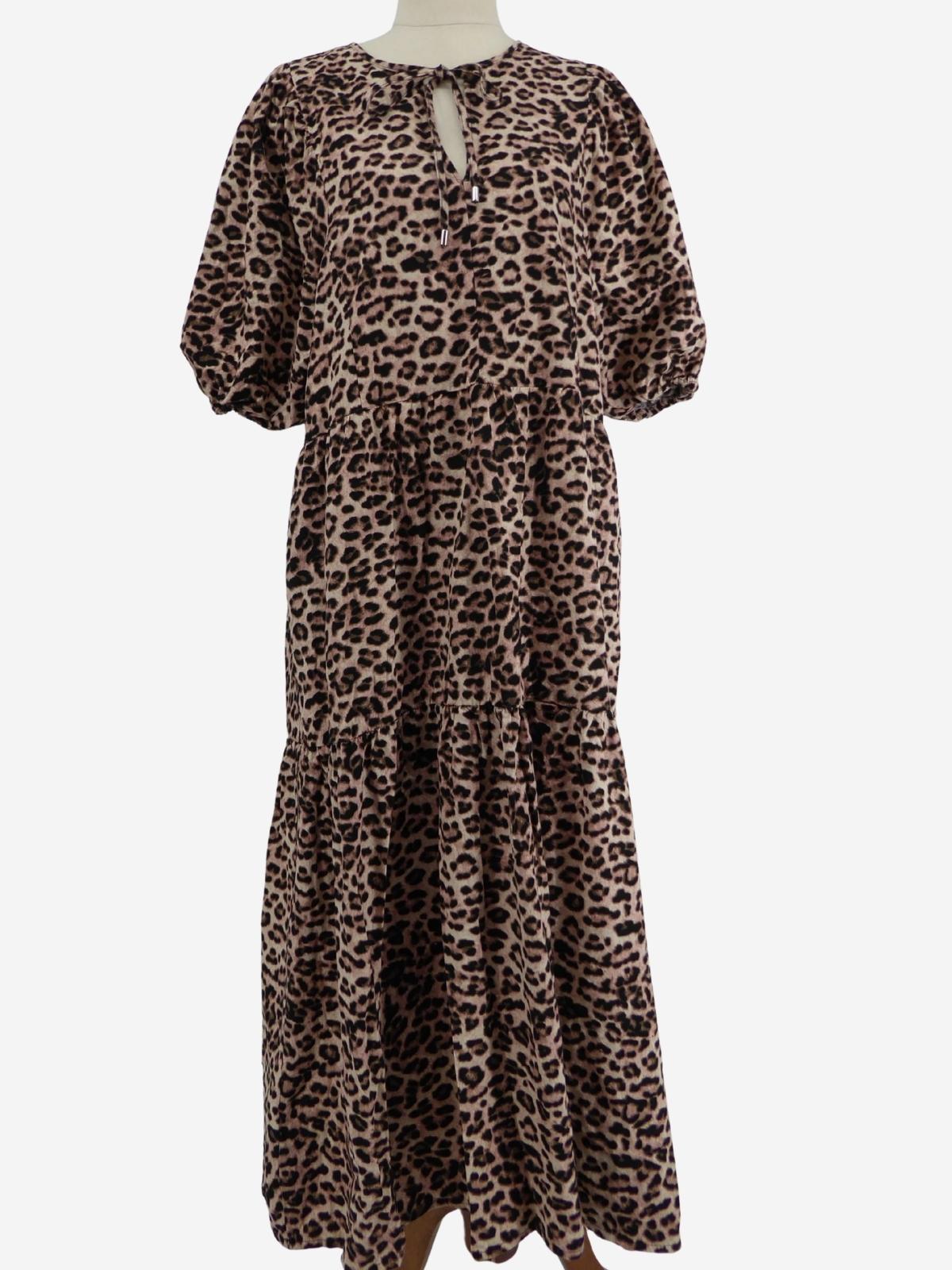A long-sleeved Decjuba animal print midi dress, displayed on a mannequin against a white studio background.