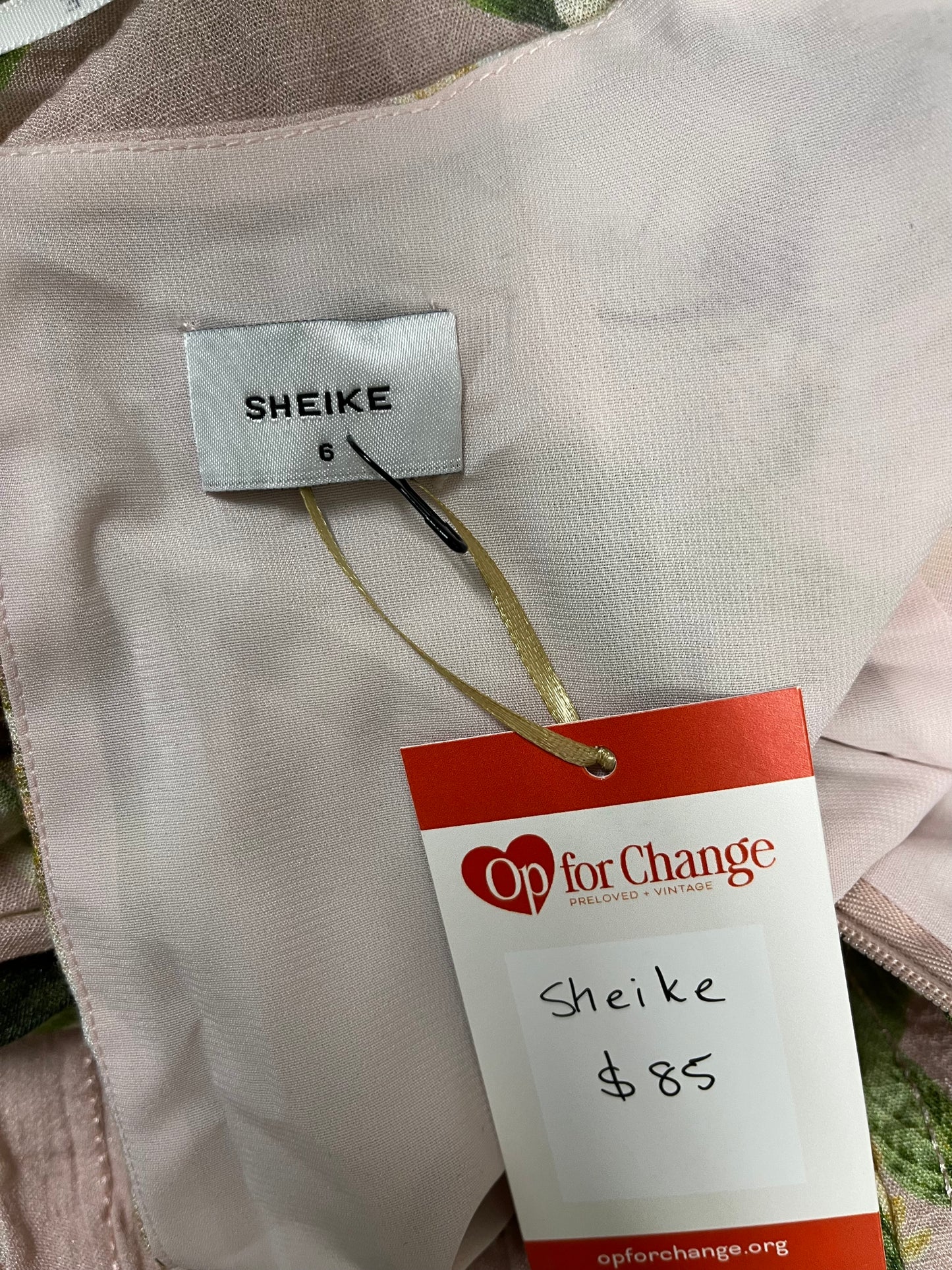 Sheike clothing tag on a garment with Op for Change label.