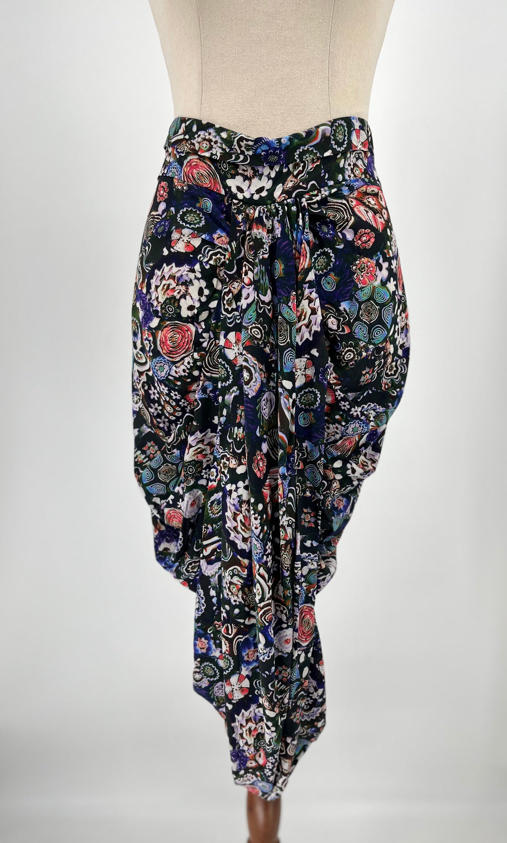 Floral patterned skirt on a mannequin against a white background