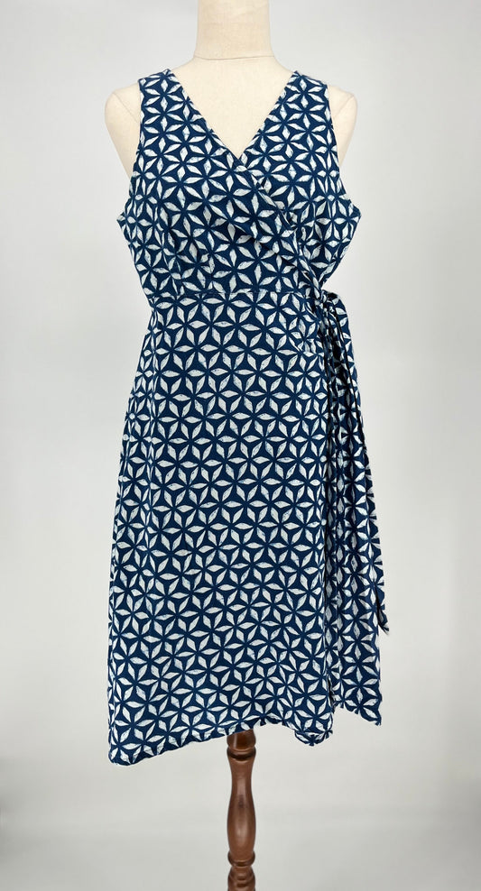 Blue geometric patterned dress on a mannequin against a white background