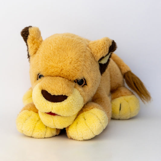 Plush lion toy on a white background