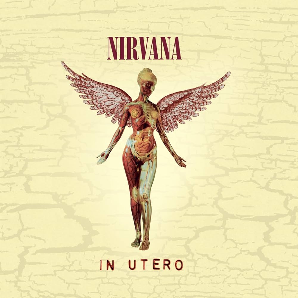 Album cover for Nirvana's 'In Utero' with a winged figure on a textured beige background.