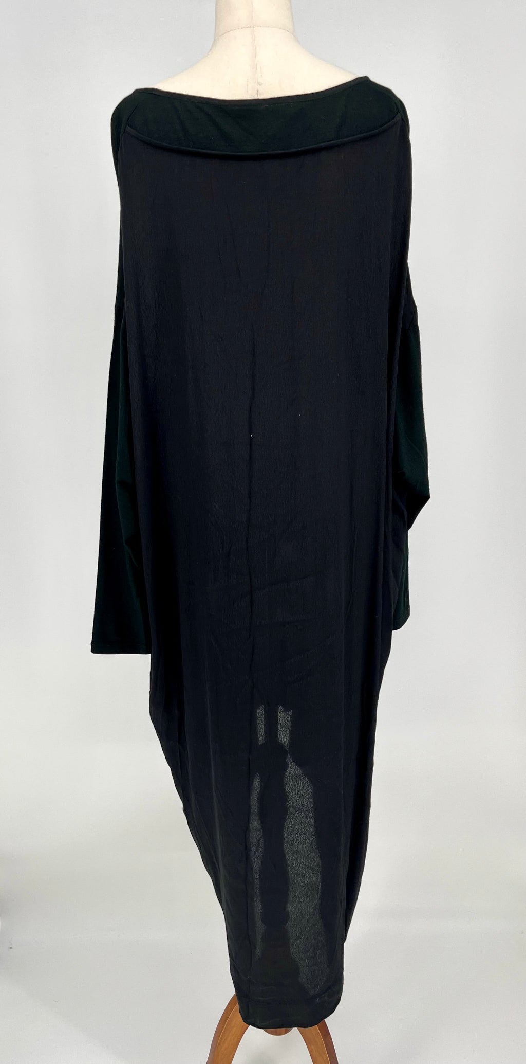 Black dress on a mannequin against a white background