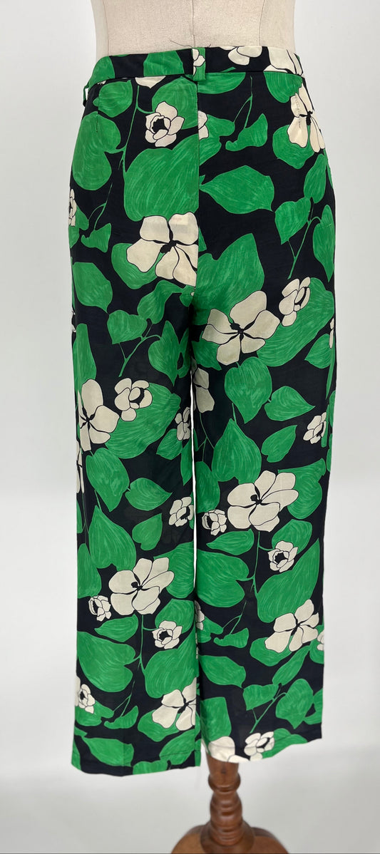Floral-patterned pants on a mannequin against a white background