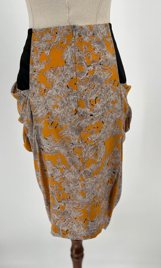 Skirt with yellow and gray pattern on a mannequin against a white background