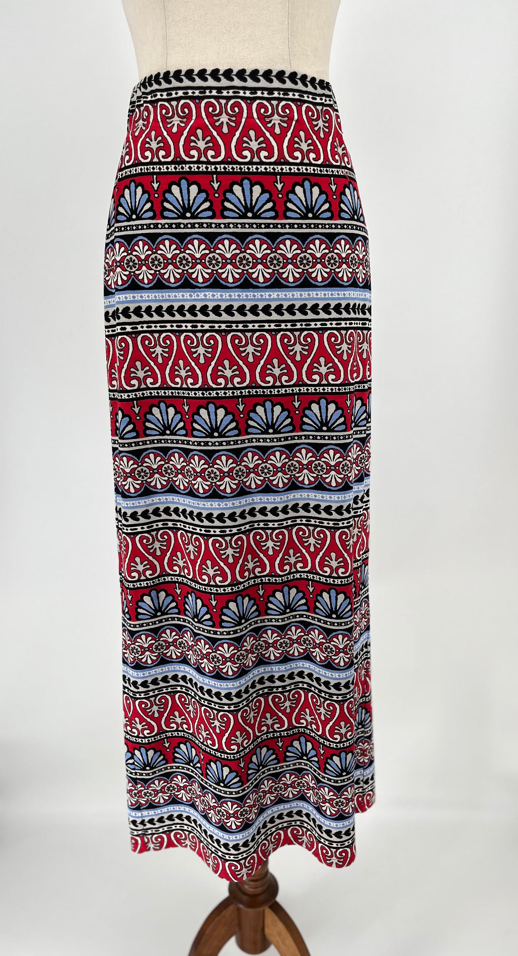 Patterned skirt on a mannequin against a white background