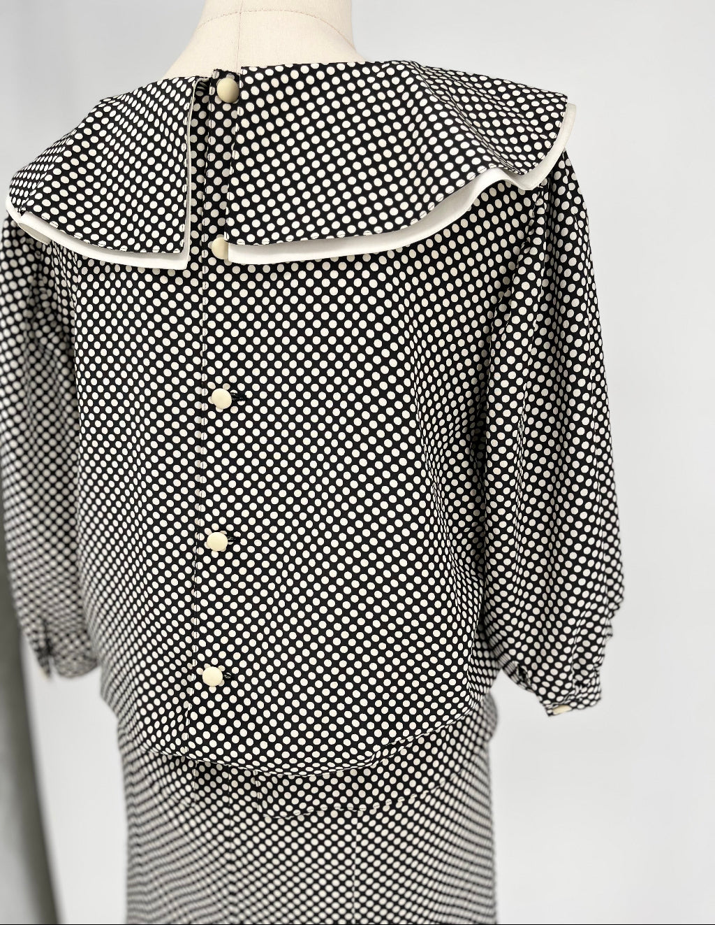 Black and white spotty dress on mannequin