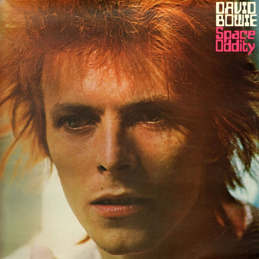 Music CD featuring a close-up of David Bowie with red hair and text 'David Bowie Space Oddity'.