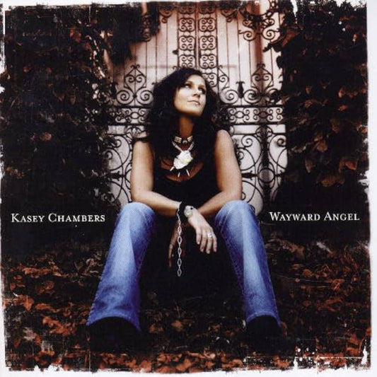 Album cover featuring singer Kasey Chambers sitting on a decorative bench with text 'Kasey Chambers' and 'Wayward Angel'.