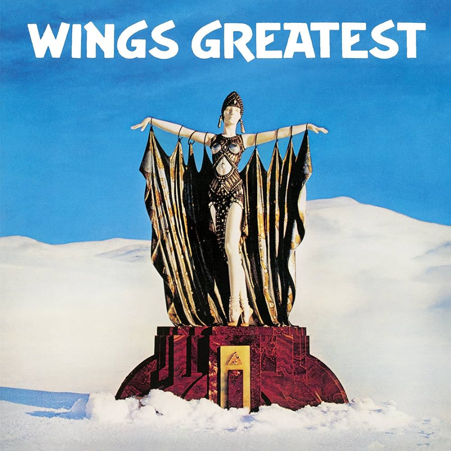Wings Greatest album cover. Statue in a snowy landscape with 'Wings Greatest' text at the top.